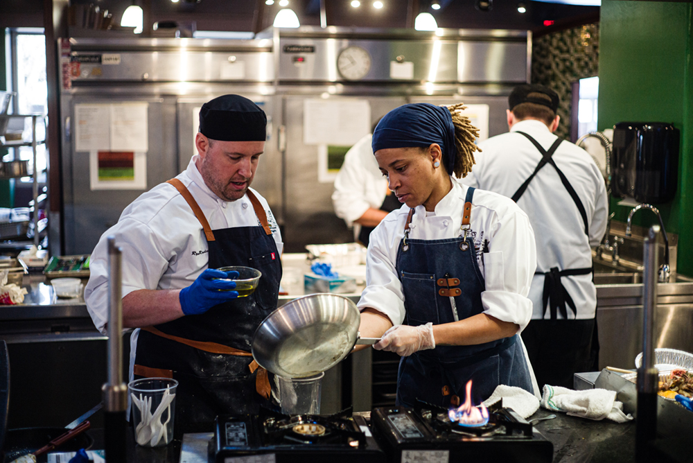 Chefs Ryan Rodenhaus and Kaprishia Covington preparing a meal