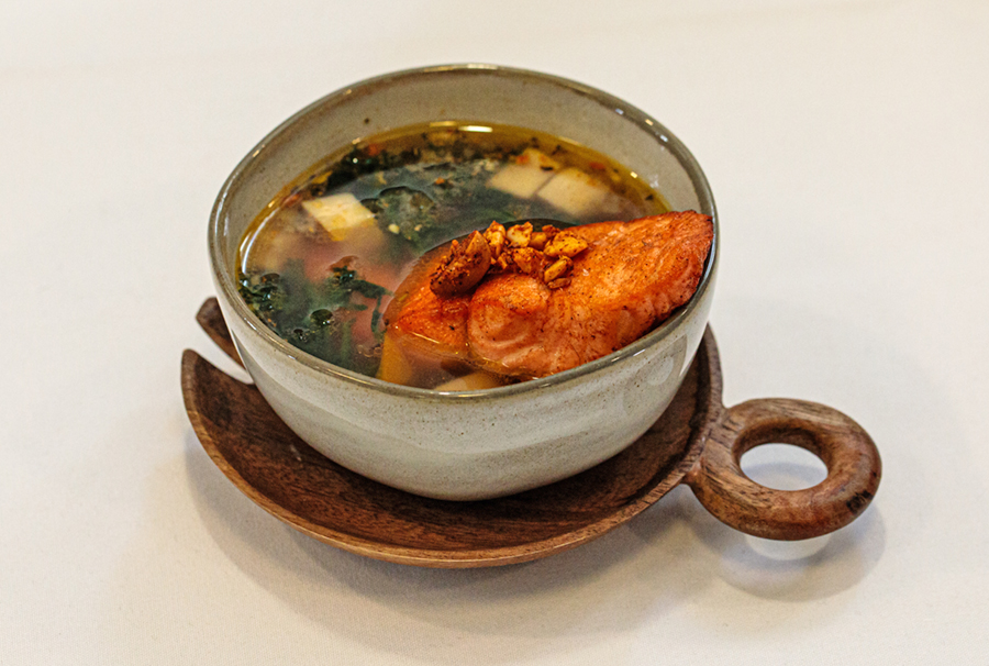 Soup: Steelhead Trout Mélange. Pan-seared steelhead trout atop of seafood and vegetable broth, topped with salted almonds