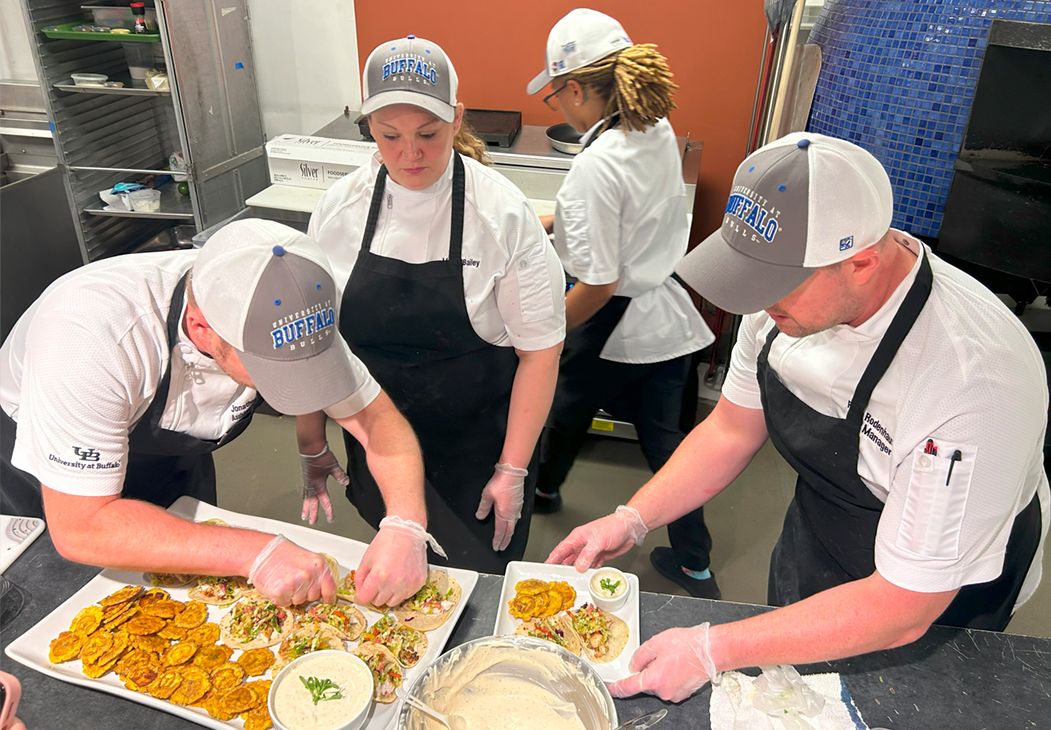 Chefs Jonathan Kersting, Megan Bailey, Kaprishia Covington and Ryan Rodenhaus preparing a meal