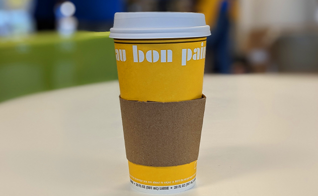 A large hot cup of Au Bon Pain coffee