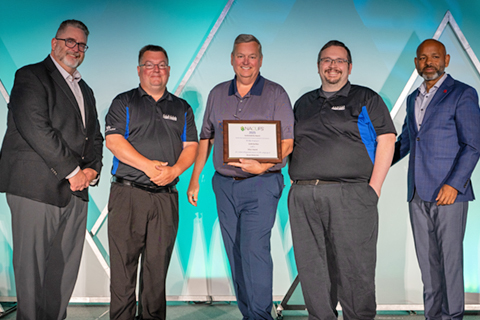 Marketing Director Ray Kohl, Executive Director Eric Blackledge, and Assistant Dining Director Tim Malley, posing with the award alongside NACUFS leaders.
