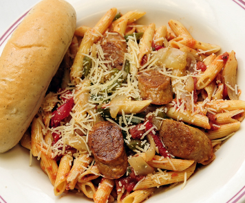Penne pasta offered at Bravo, with roasted peppers and onions, Italian sausage, cheese and a breadstick on the side