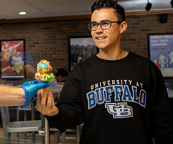 Student being served an ice cream cone