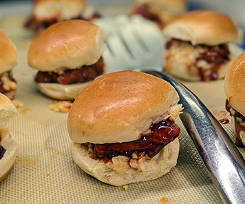 Pork belly sliders featured from the grill