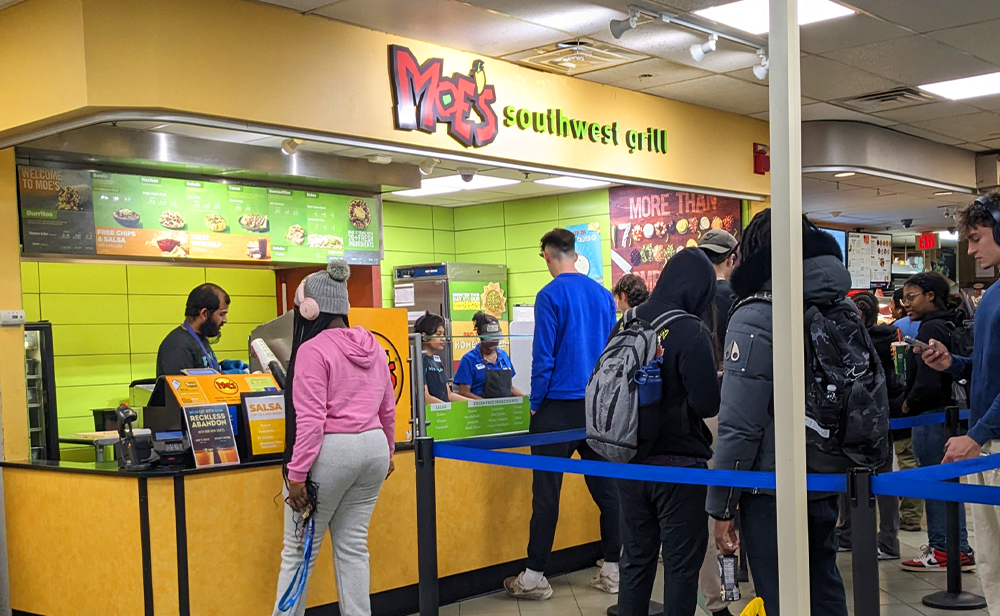A queue of students outside the Moe's in the Student Union