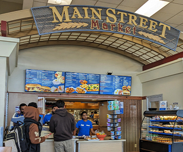 Main Street Market sign and digital signage showing the lunch menu