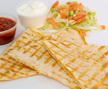 Cheese quesadilla with salsa, sour cream and lettuce and tomato