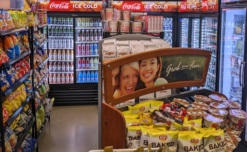 shelves of snacks and beverages inside the Main Street Market Store