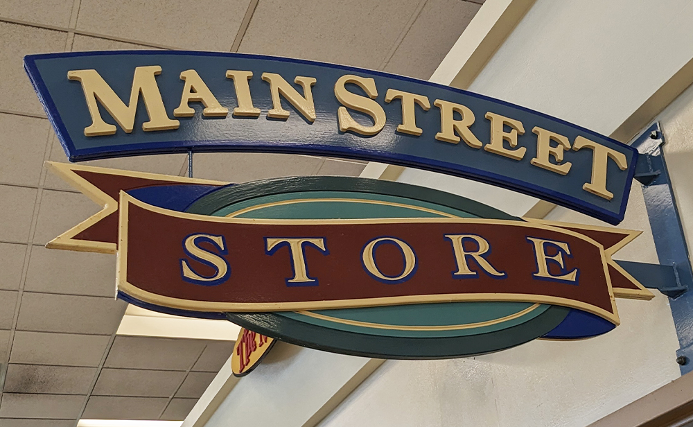 Main Street Store hanging sign outside the door