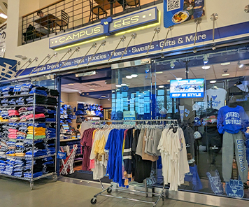 Apparel displayed outside and inside the front of the Campus Tees store