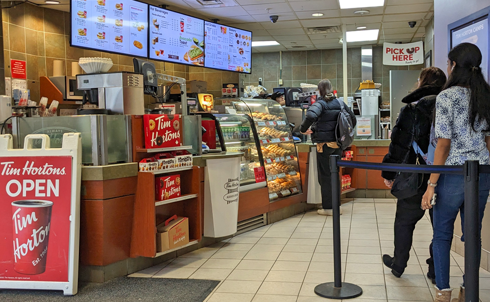 Tim Hortons Alfiero order and pickup area, featuring their digital sign menuboards