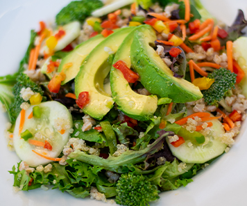 Edgy mix salad with avocado, broccoli, cucumber, quinoa, carrots and peppers from Edgy Veggies