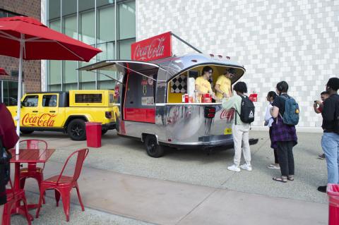 Coca-Cola Throwback truck from the front. Employees serving free Coke floats to students.
