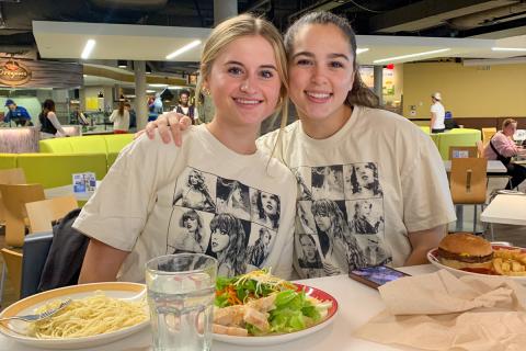 Students eating and wearing Taylor Swift shirts