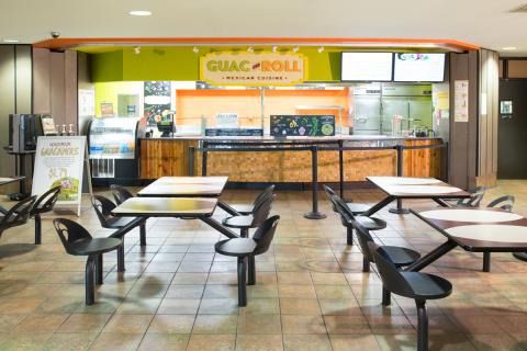 Seating area outside Guac & Roll in Ellicott Food Court. Photo by Douglas Levere.