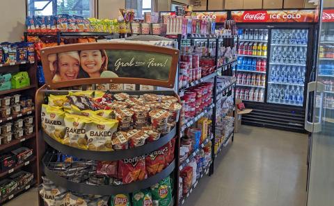 Inside Main Street Store, where chips and snacks line the shelves and Coca-Cola products are in the large cooler in the back.