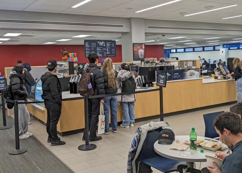 Students in line at Whispers in Silverman Library.