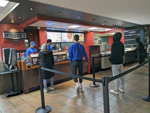 Students lining up to order at Hubies in Ellicott Food Court.