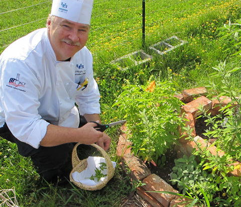 Chef Neal Plazio in the herb garden
