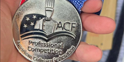 ACF Silver Medal in Chef Brendan's hand