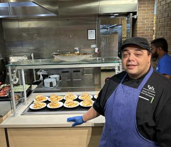 Chef Jason showcasing his featured dish at Governors Dining Center.