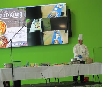Chef Neal Plazio giving a cooking lesson in the Student Union on North Campus