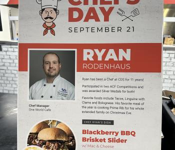Poster featuring Chef Ryan and his featured dish at One World Café.