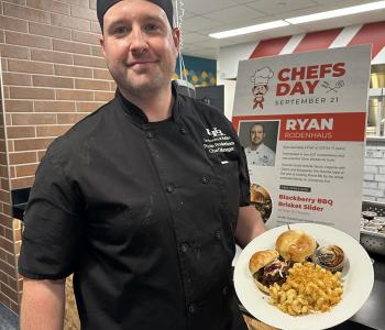 Chef Ryan showcasing his featured dish at One World Café. 