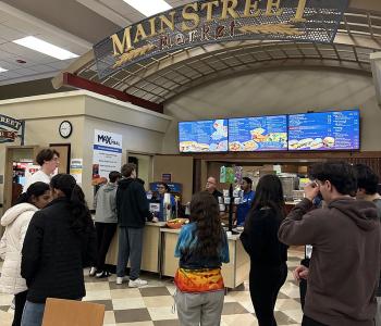 Students lining up to get their unlimited pancakes and sausage at Main Street Market