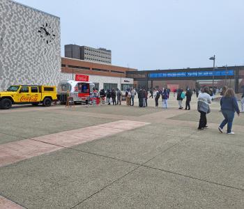 Line forming from the Coca Cola Throwback car