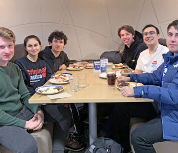 Six students at Crossroads (C3) eating a meal together