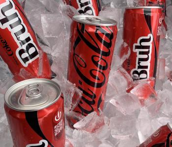 Coca Cola cans in ice, many of which say "Bruh"