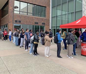 Line forming at the Have a Coke Day table