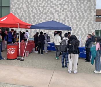 Line forming at the Have a Coke Day table