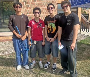 Students posing with their golf clubs