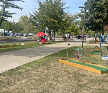 Students playing mini golf