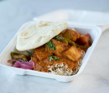 Curry rice with naan from Tikka Table. Photo by Onion Studio.