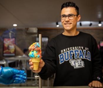 A student receiving an ice cream cone at The Cellar. Photo by Meredith Forrest Kulwicki.