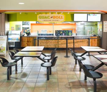 Seating area outside Guac & Roll in Ellicott Food Court. Photo by Douglas Levere.