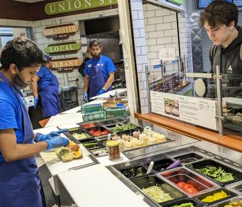An associate creating a sub for a student at Union Station.