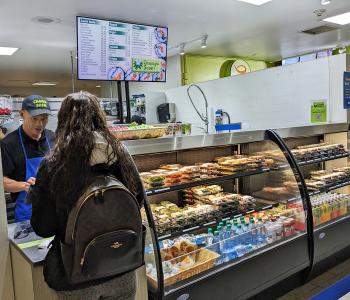 Student ordering from Champa Sushi from an associate.