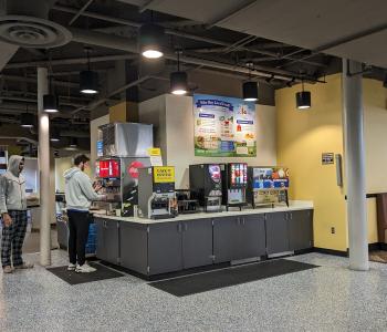 Students getting drinks at the beverage station at C3.