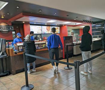 Students lining up to order at Hubies in Ellicott Food Court.