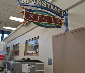 The Main Street Store sign located within Main Street Market / Goodyear Dining Center next to the registers.