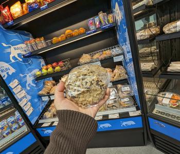 Grabbing a cookie at the Bulls on the Run grab & go shelves in Natural Sciences Complex.