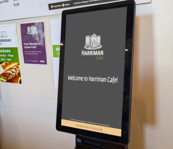 The welcome screen on the Harriman Café order kiosk.