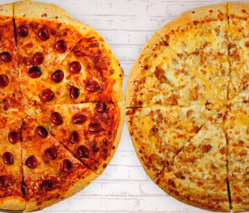 Whole pepperoni and chicken finger pizzas from above.